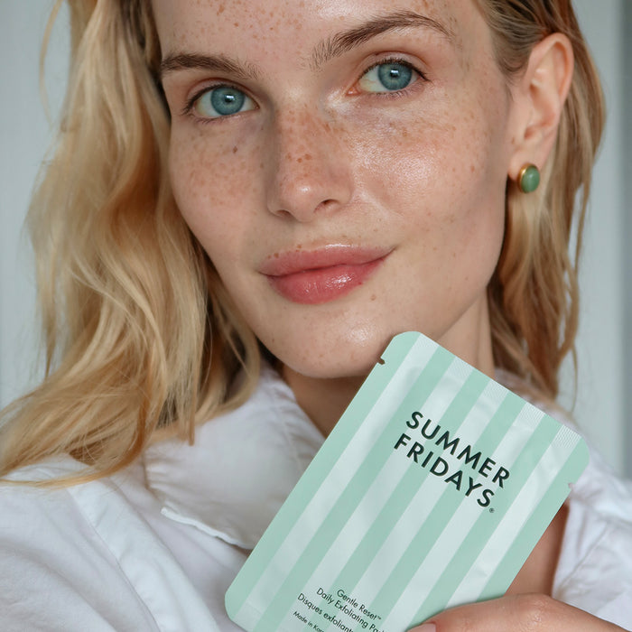 Woman holding a 'Summer Fridays' product packaging