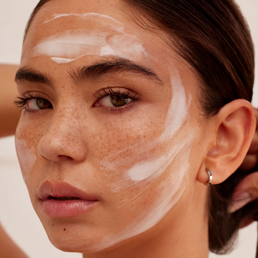 Woman with Jet Kag Overnight applied on her face