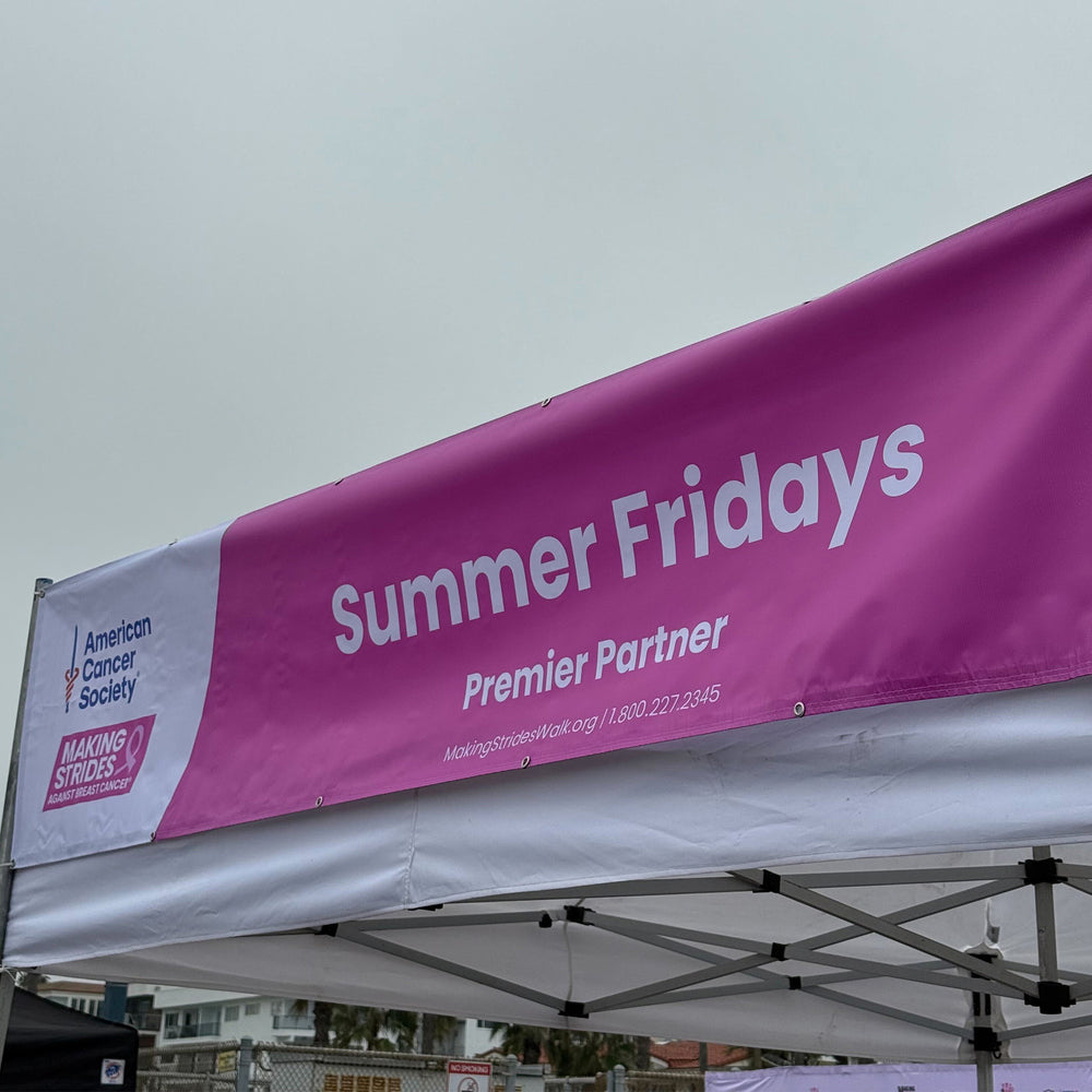 Pink and white banner with 'Summer Fridays' and 'American Cancer Society' text on a tent roof.